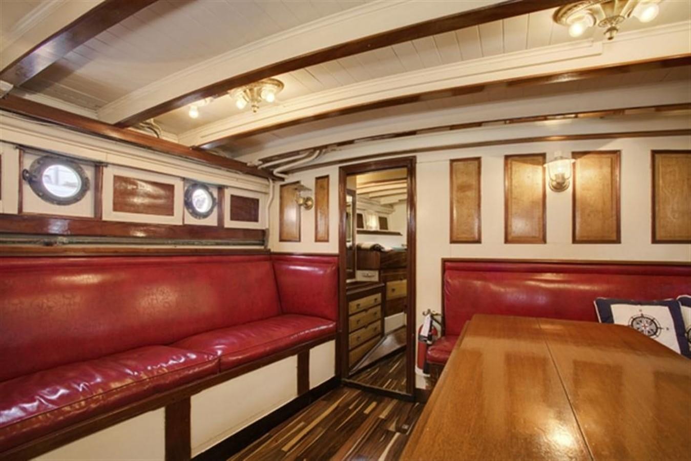a room with a couch and a table aboard SYRENE I Yacht for Sale