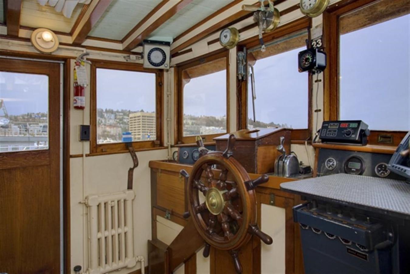 a room with a fan and a table aboard SYRENE I Yacht for Sale