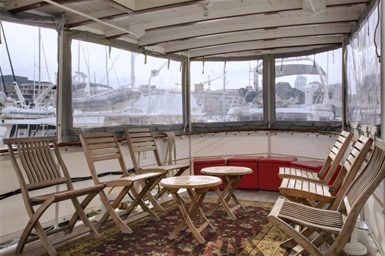 a room with chairs and tables aboard SYRENE I Yacht for Sale