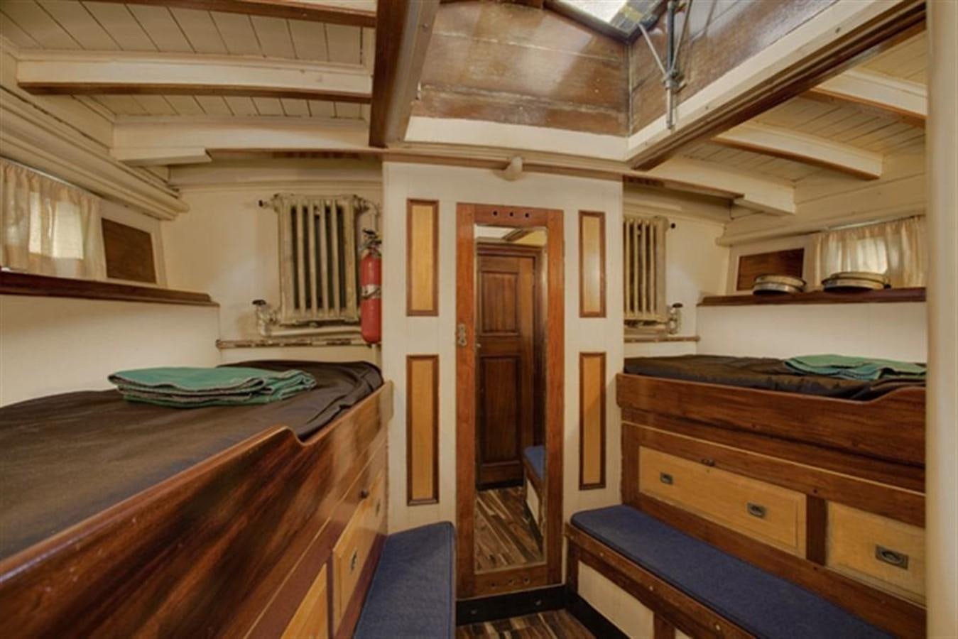 a room with a bed and a closet aboard SYRENE I Yacht for Sale