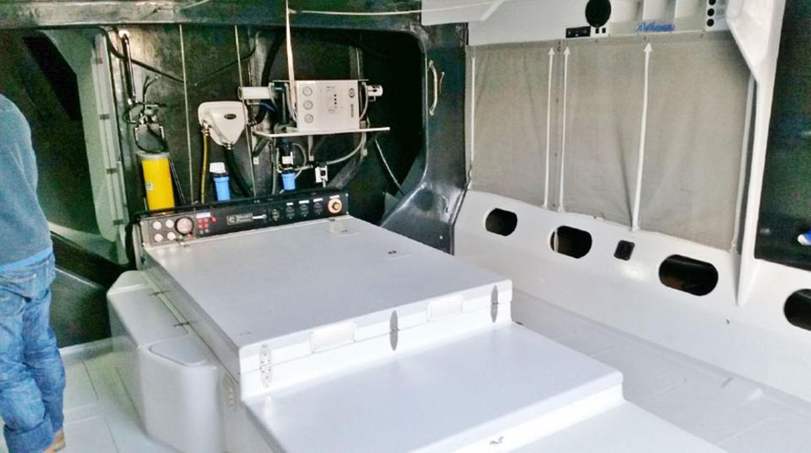 a machine with a large piece of equipment on it aboard ROTHMANS Yacht for Sale