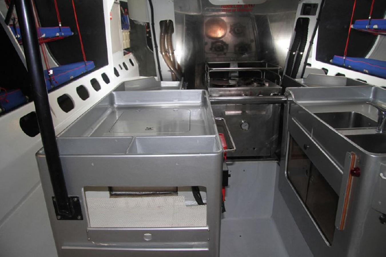 a machine with a large metal cylinder aboard ROTHMANS Yacht for Sale