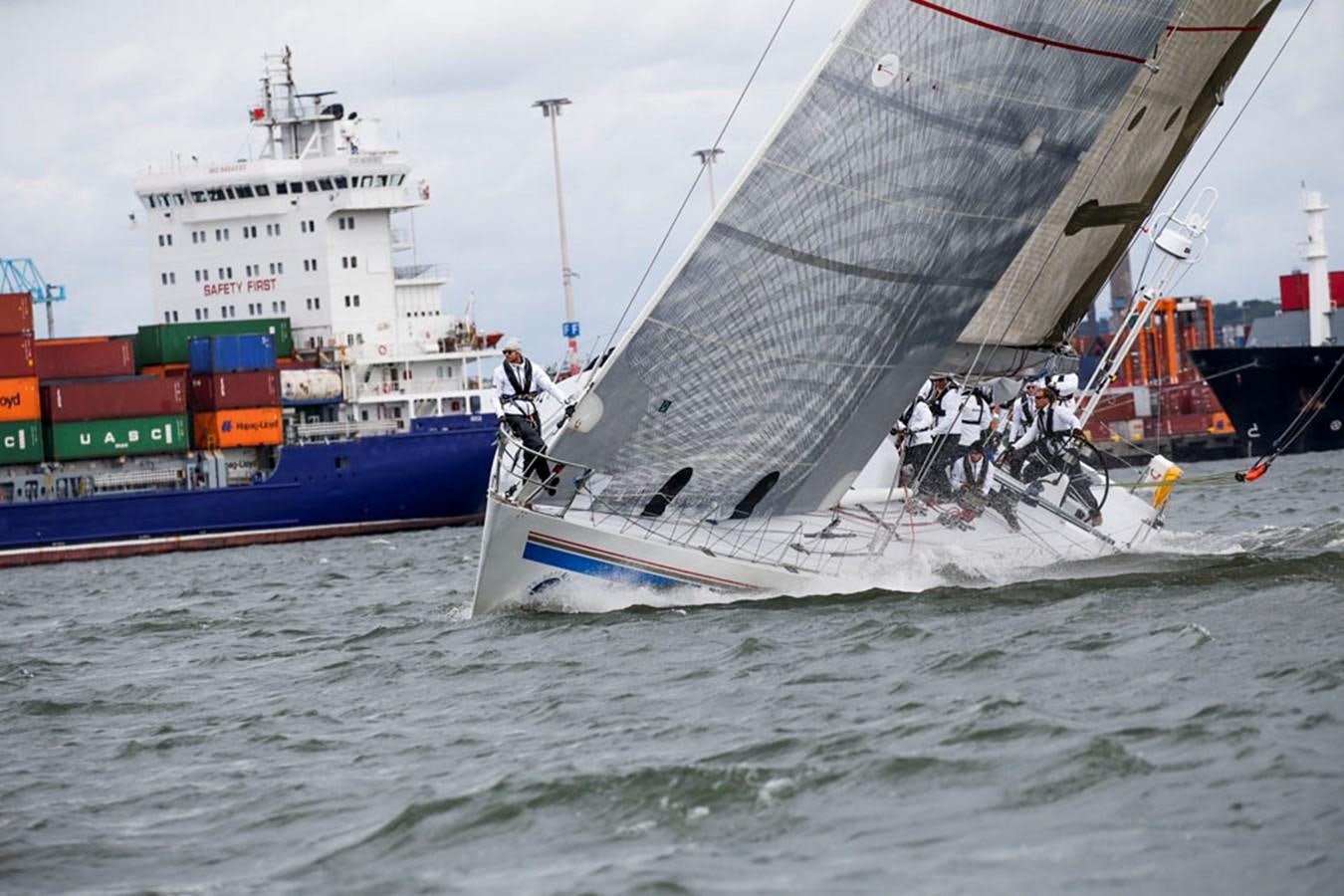 a boat sailing on the water aboard ROTHMANS Yacht for Sale