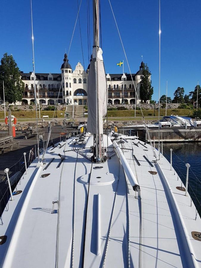 a large boat in a harbor aboard ROTHMANS Yacht for Sale