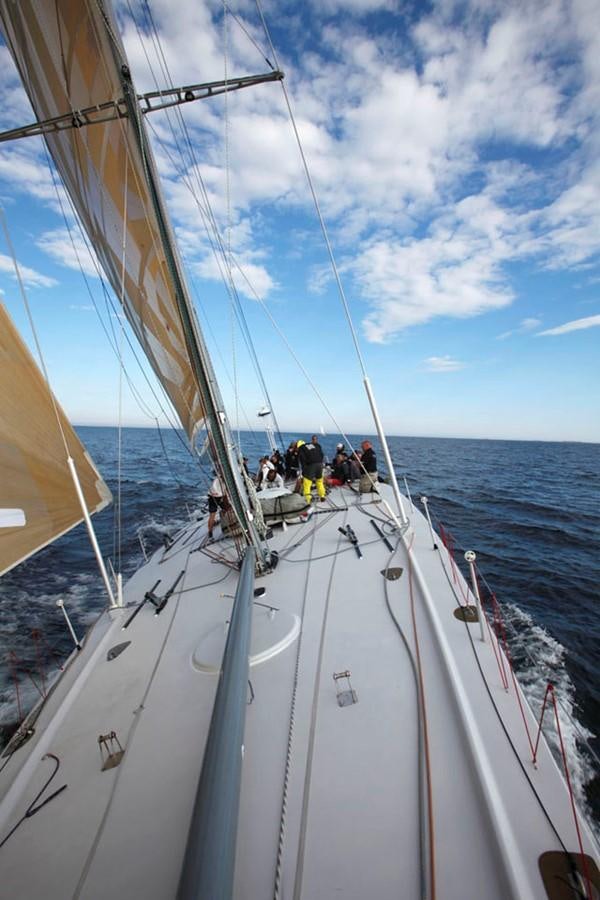 a group of people on a sailboat aboard ROTHMANS Yacht for Sale