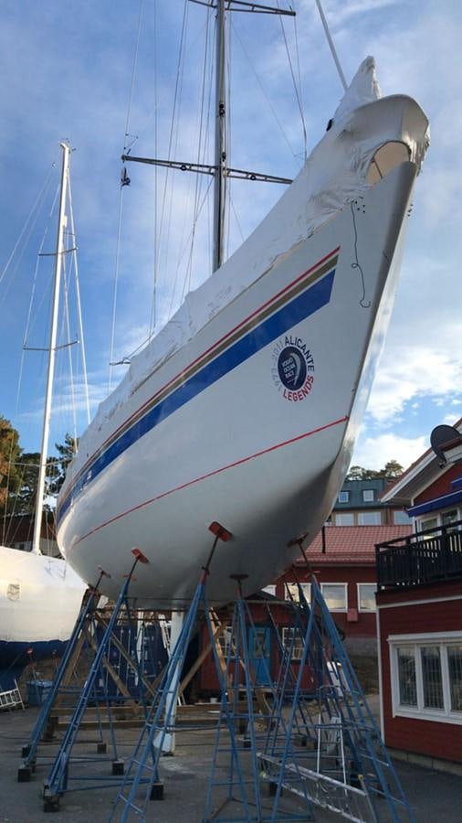 a large white boat on a dock aboard ROTHMANS Yacht for Sale