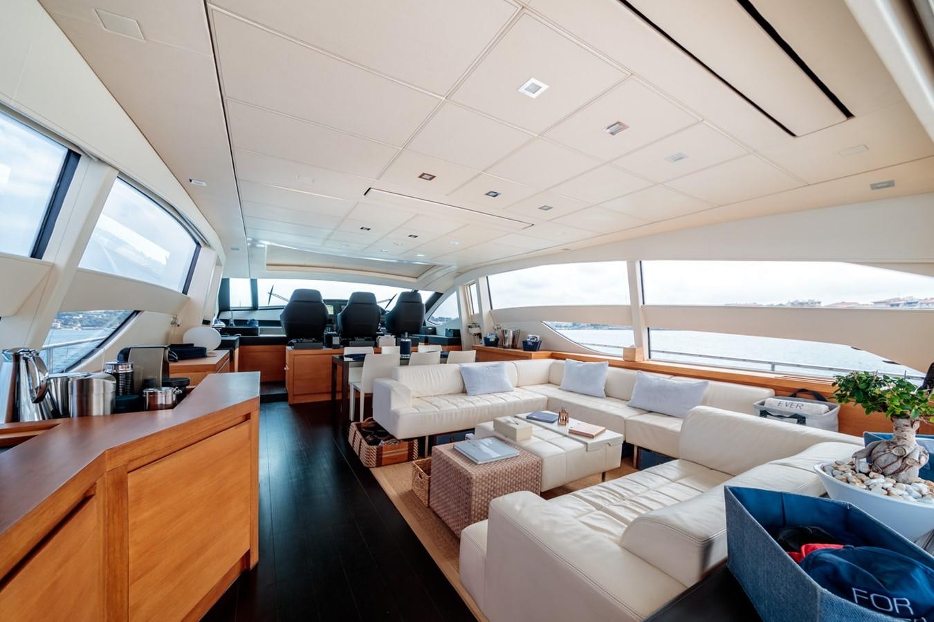 a room with couches and a table aboard FOR EVER Yacht for Sale