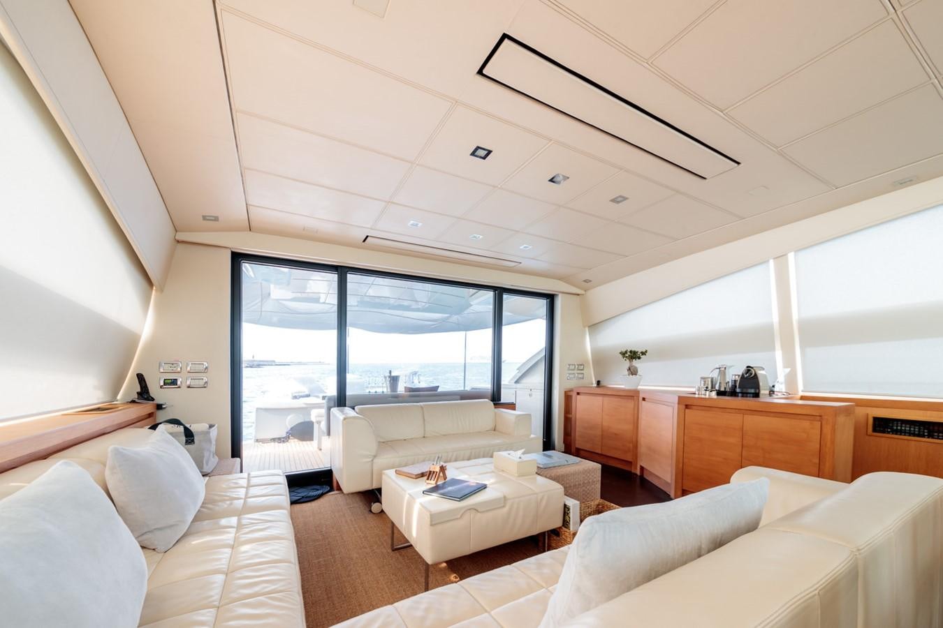 a living room with a large window aboard FOR EVER Yacht for Sale