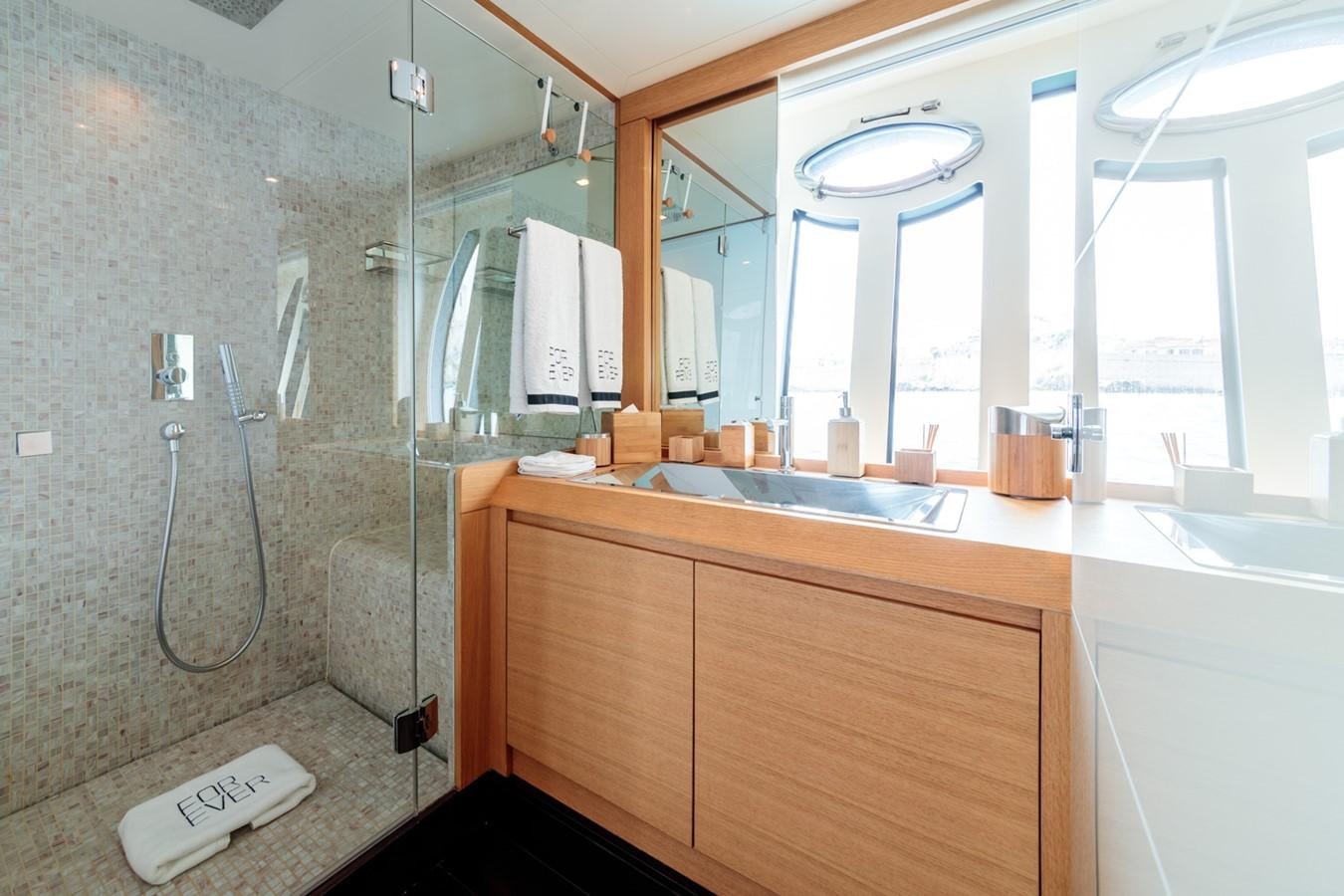 a bathroom with a shower unit and sink aboard FOR EVER Yacht for Sale