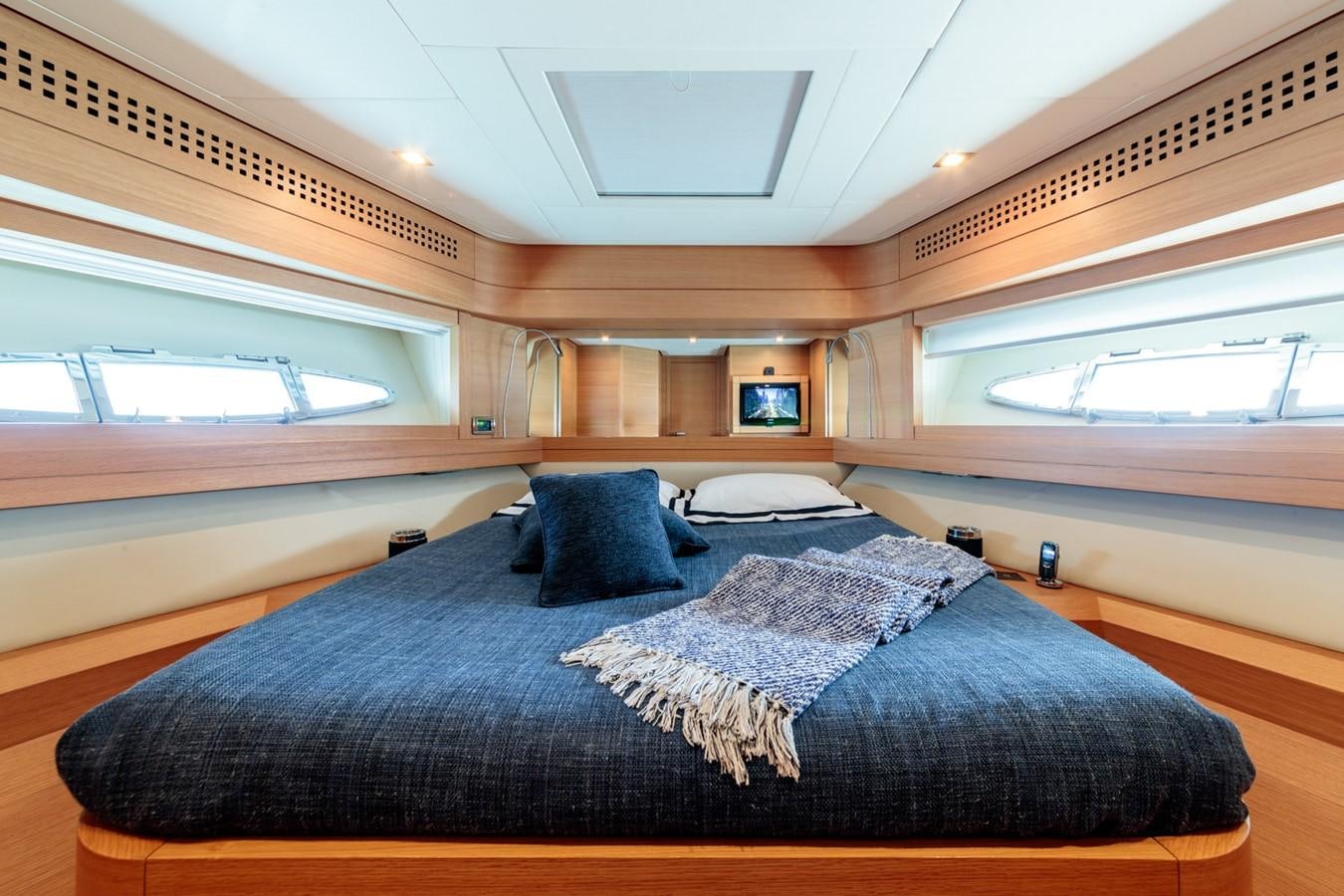 a bed in a room aboard FOR EVER Yacht for Sale
