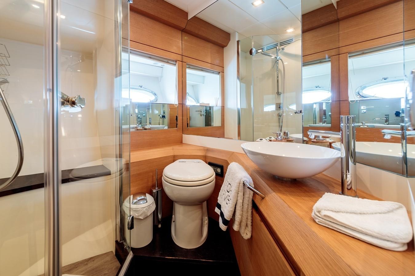a bathroom with a sink toilet and a mirror aboard FOR EVER Yacht for Sale