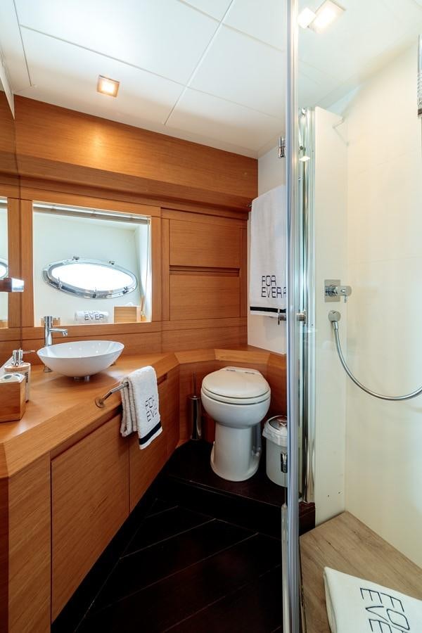 a bathroom with a sink and toilet aboard FOR EVER Yacht for Sale