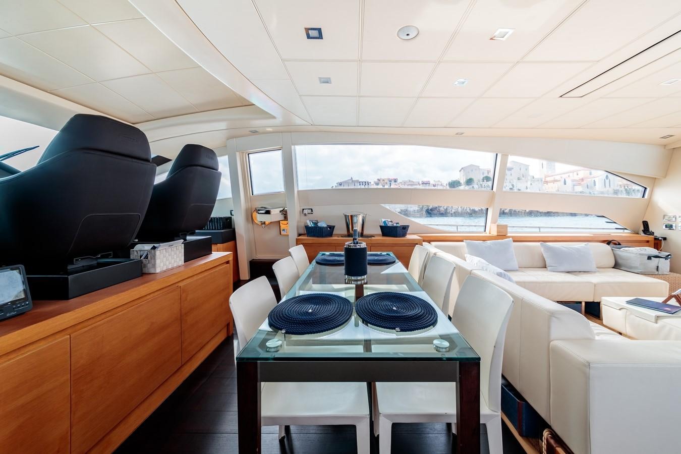 a room with a table and chairs aboard FOR EVER Yacht for Sale