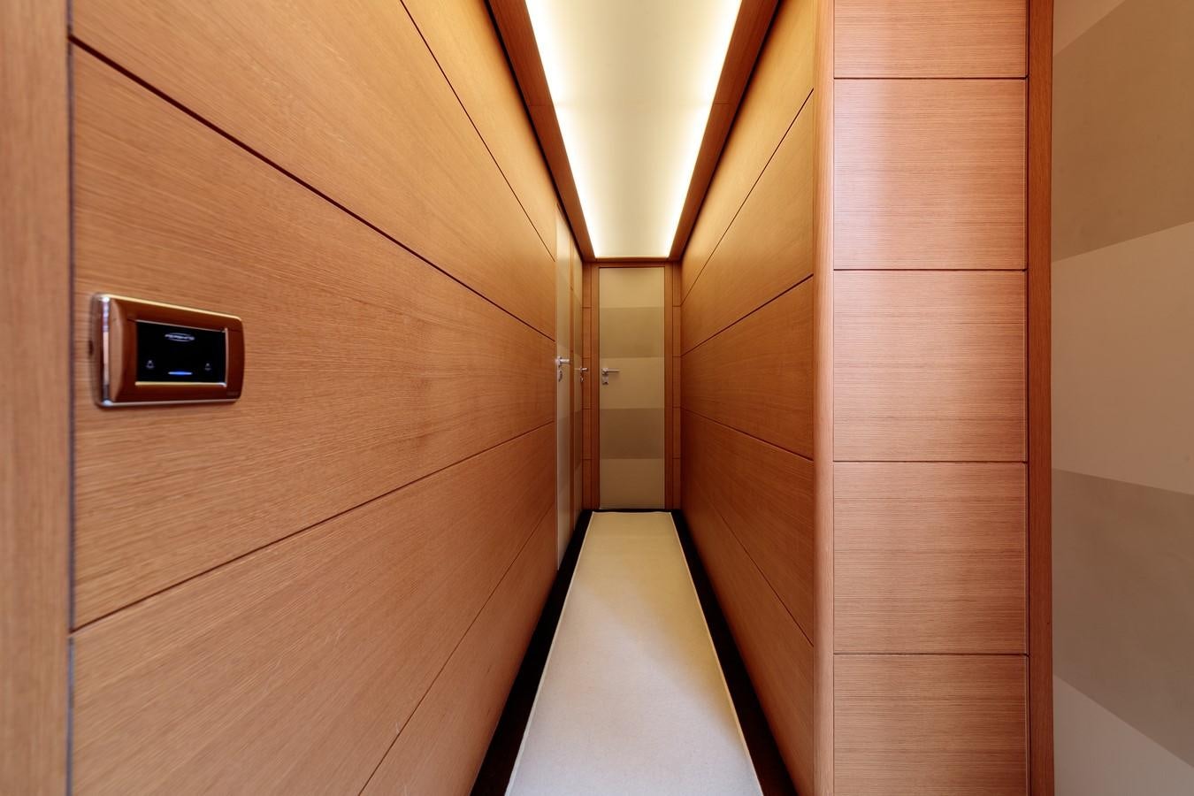 a wooden door with a light on it aboard FOR EVER Yacht for Sale
