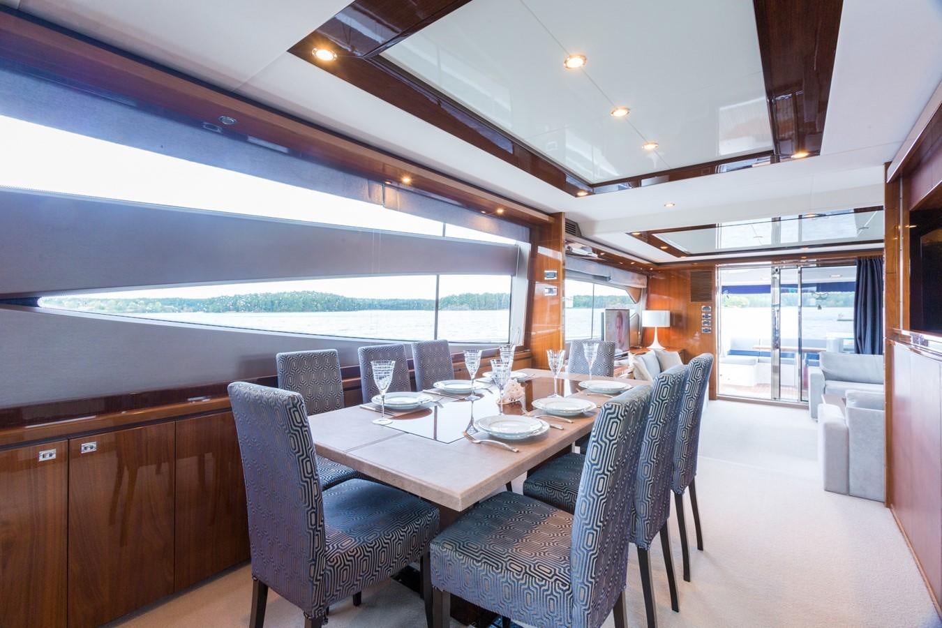 a dining room with a large table aboard PRINCESS 78 MY Yacht for Sale
