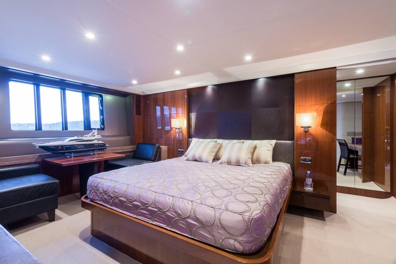 a large bedroom with a large bed aboard PRINCESS 78 MY Yacht for Sale