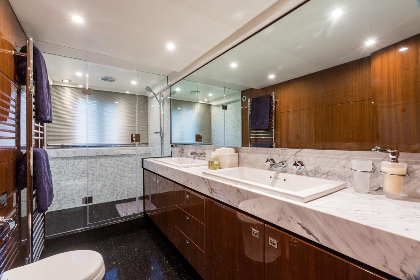 a bathroom with a large mirror aboard PRINCESS 78 MY Yacht for Sale