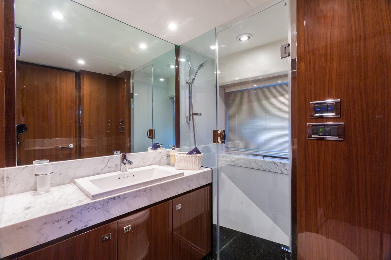 a bathroom with a large mirror aboard PRINCESS 78 MY Yacht for Sale
