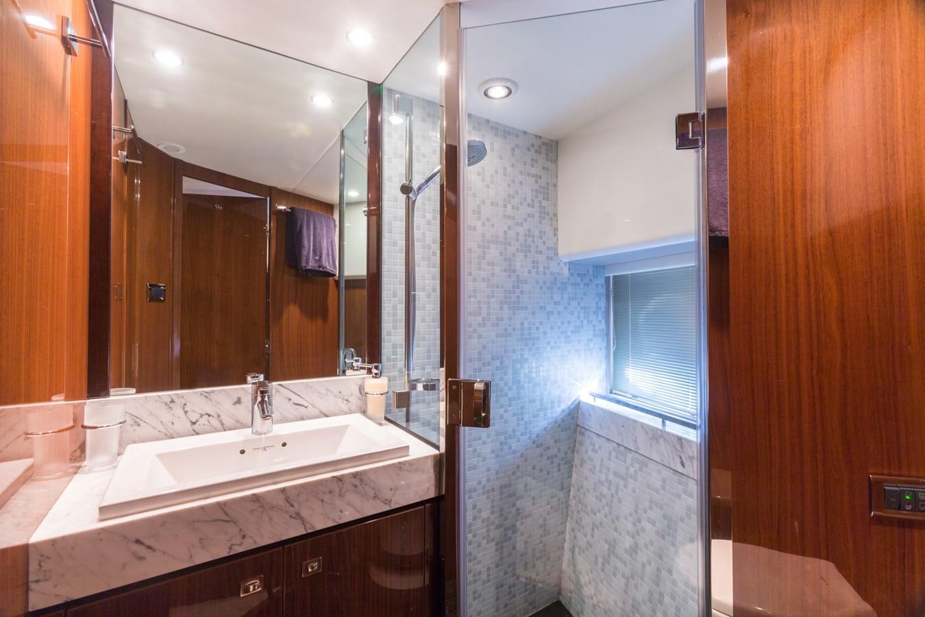 a bathroom with a large mirror aboard PRINCESS 78 MY Yacht for Sale