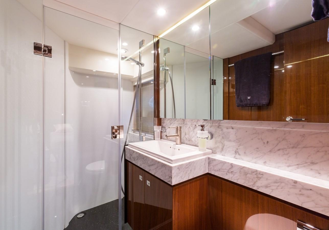 a bathroom with a large mirror aboard PRINCESS 78 MY Yacht for Sale