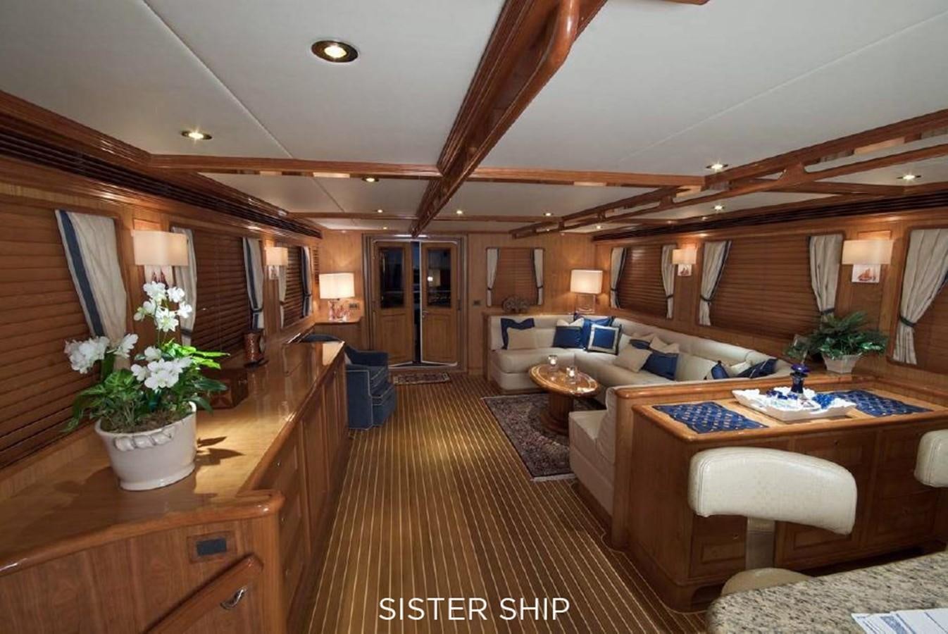 a room with a couch and a table aboard 800 MY Yacht for Sale