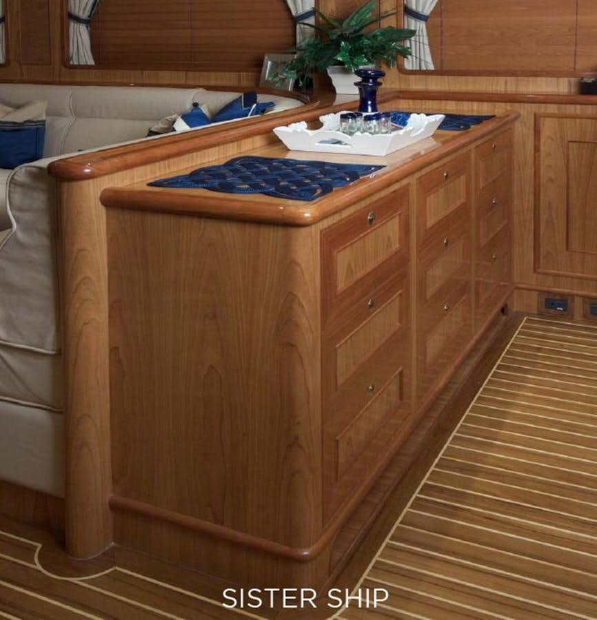 a wooden cabinet with drawers aboard 800 MY Yacht for Sale