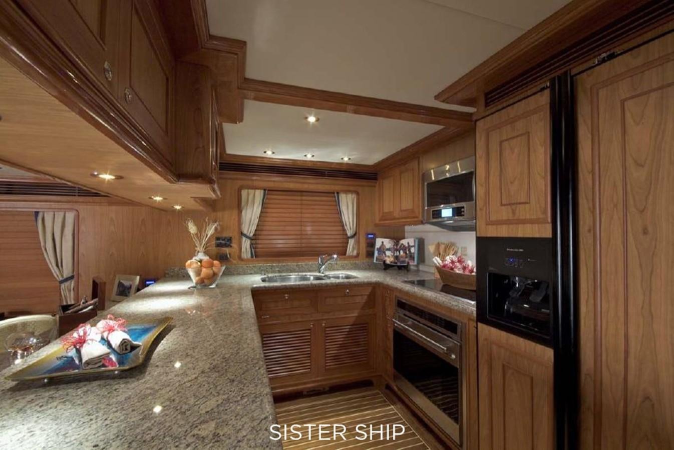 a kitchen with wooden cabinets aboard 800 MY Yacht for Sale