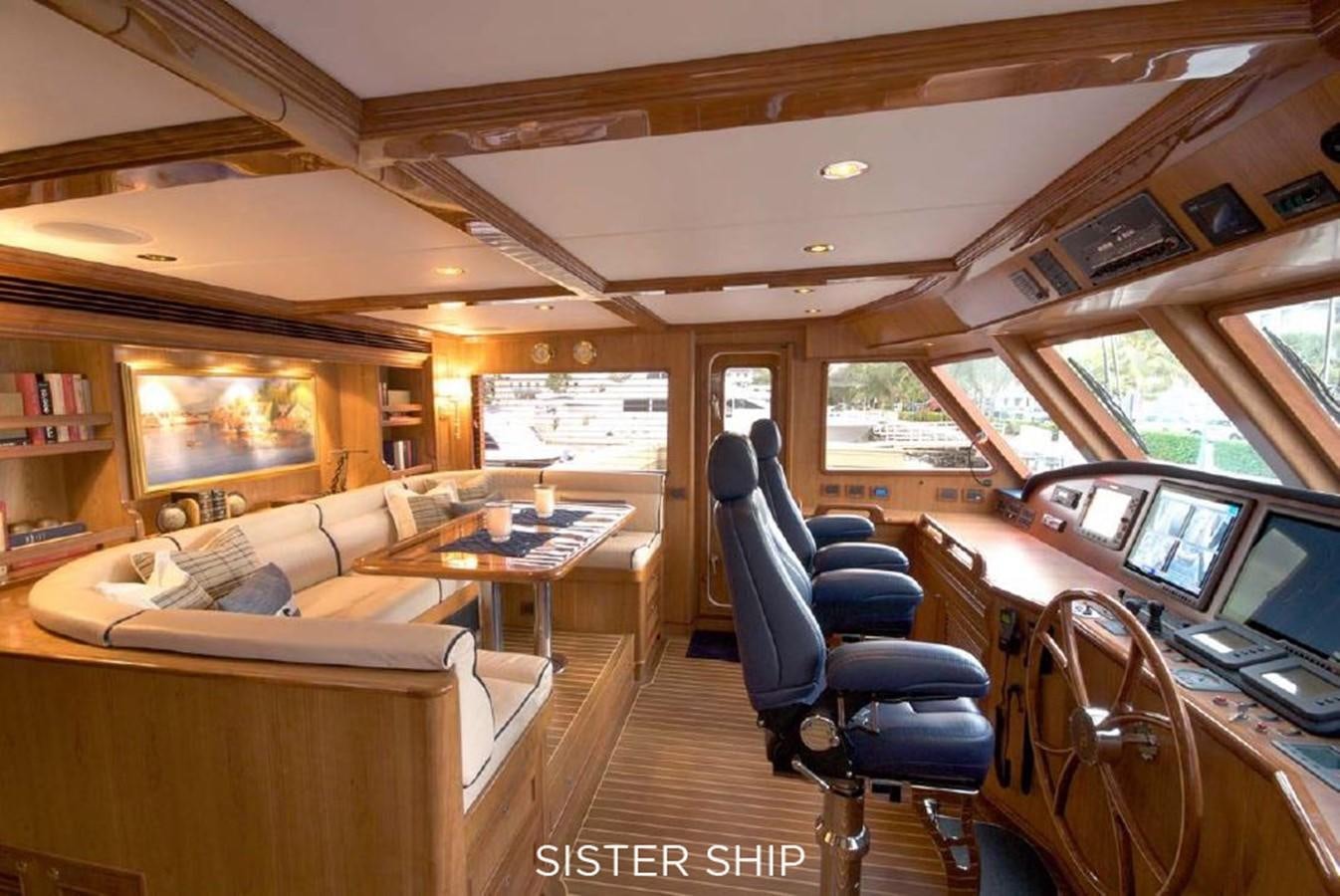 a room with a couch and a table aboard 800 MY Yacht for Sale