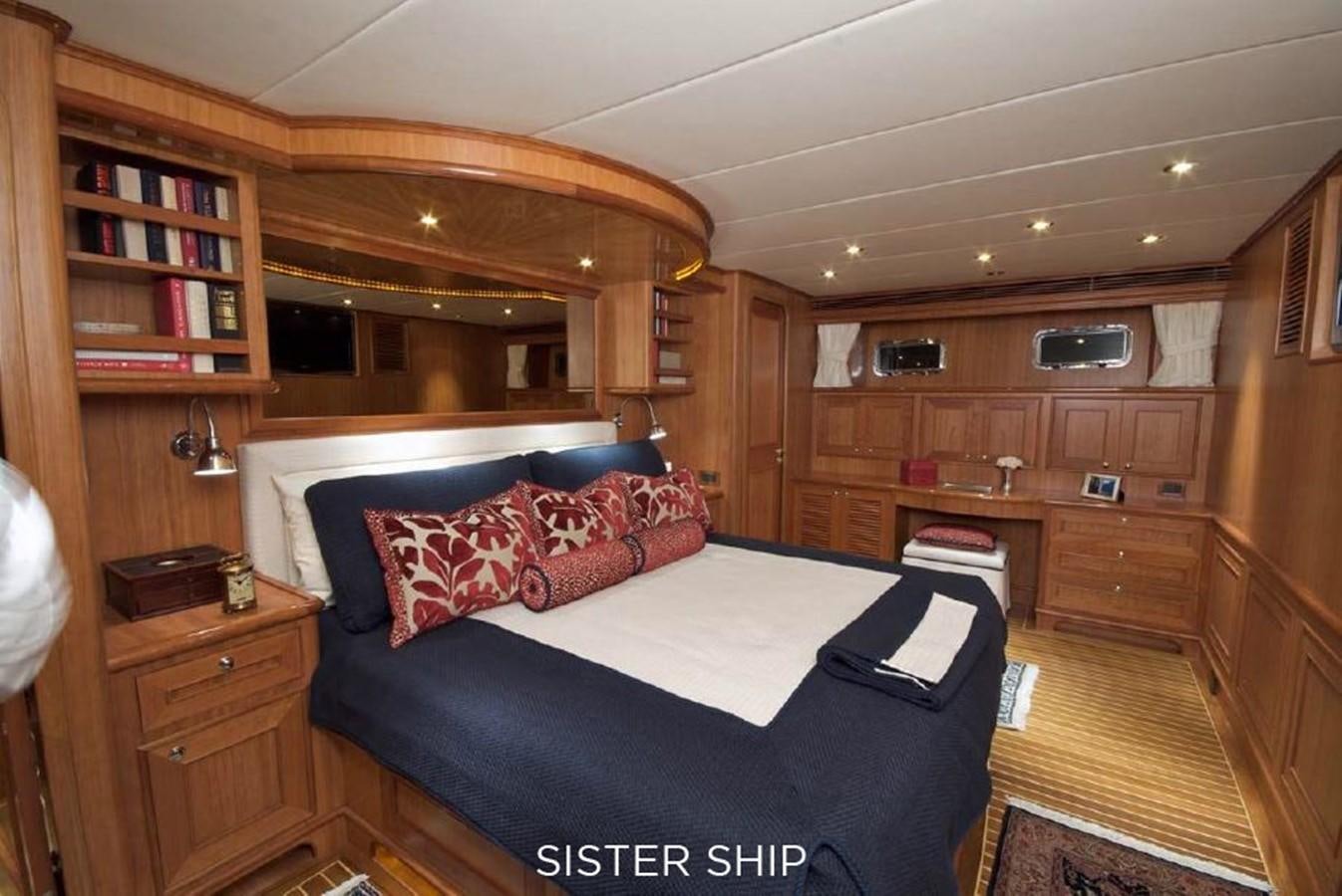 a bedroom with a bed and a desk aboard 800 MY Yacht for Sale