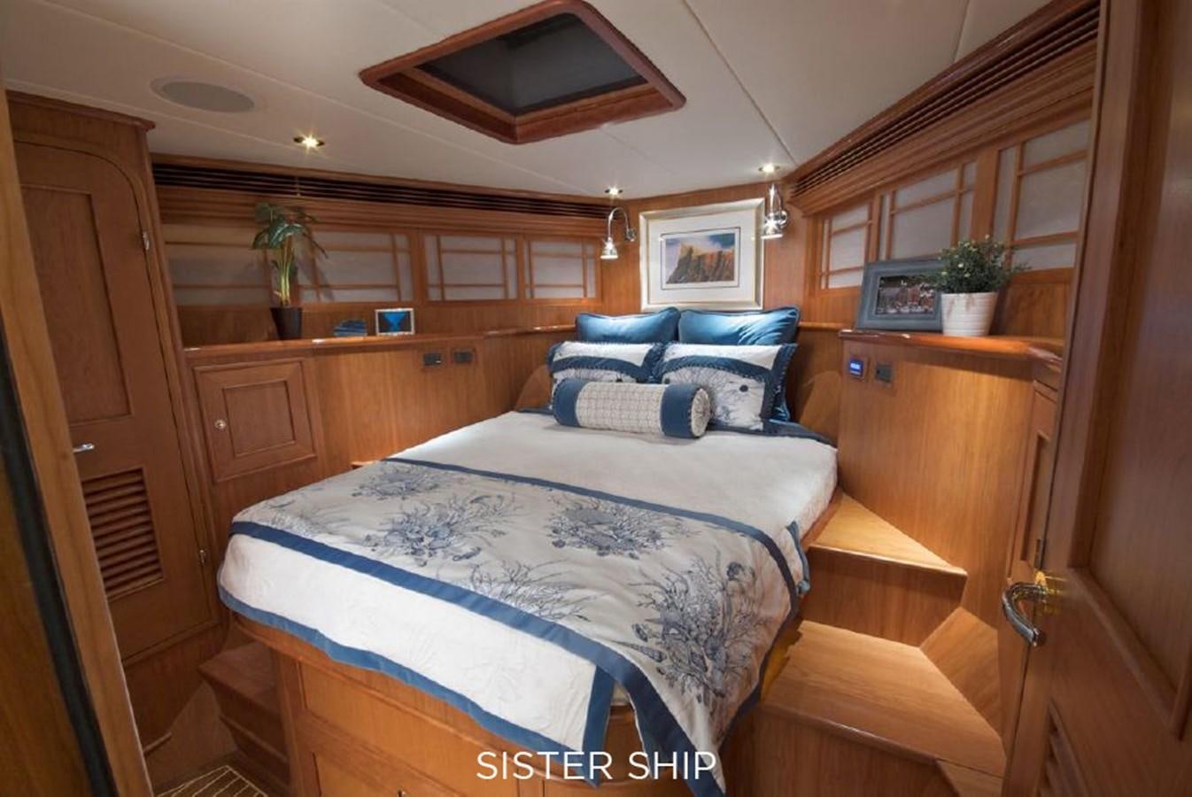 a bedroom with a bed and a desk aboard 800 MY Yacht for Sale