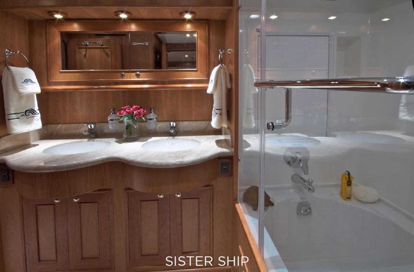 a bathroom with a bathtub sink and a mirror aboard 800 MY Yacht for Sale