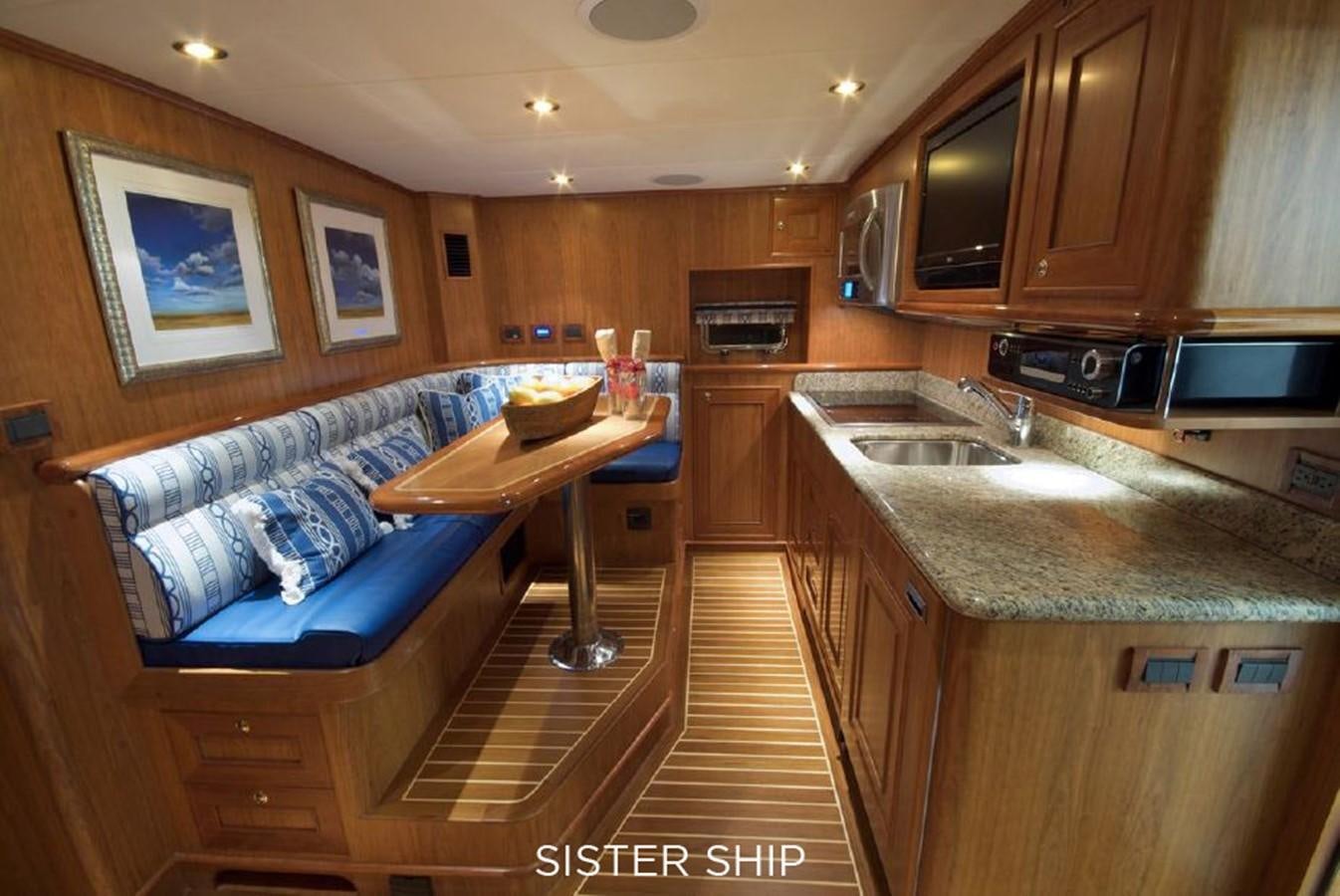 a kitchen with a bed and a couch aboard 800 MY Yacht for Sale