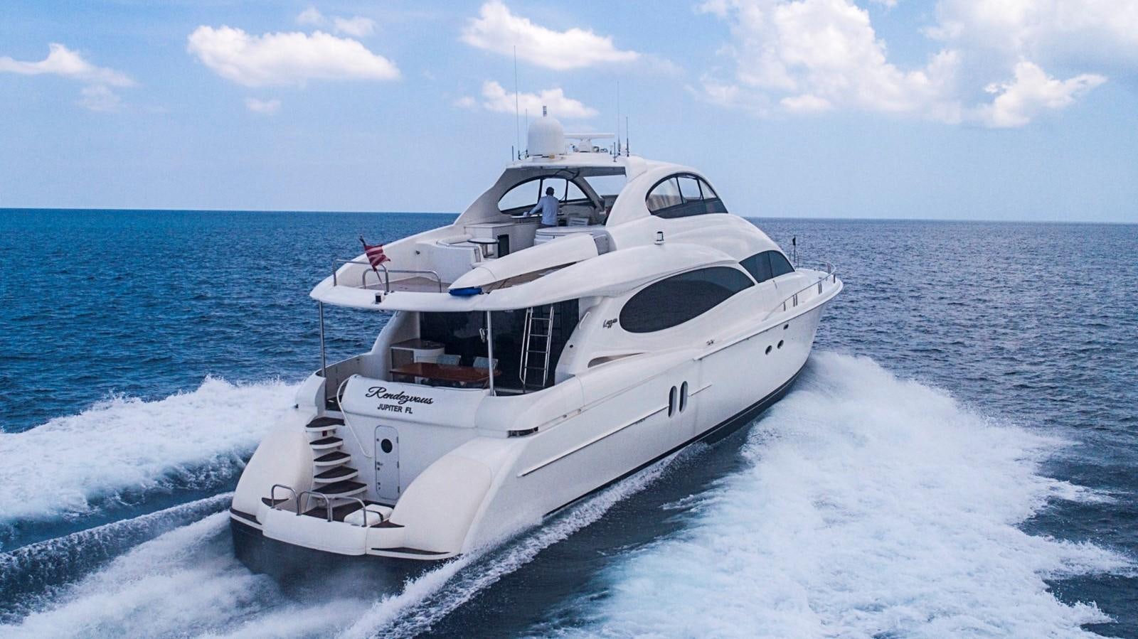 a white yacht on the water aboard RENDEZVOUS Yacht for Sale