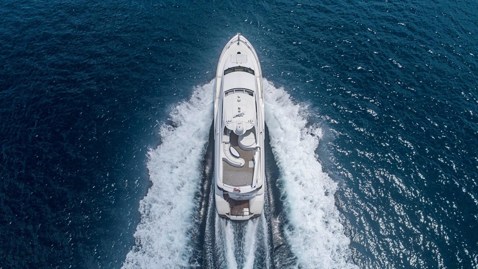 a white car on a road aboard RENDEZVOUS Yacht for Sale