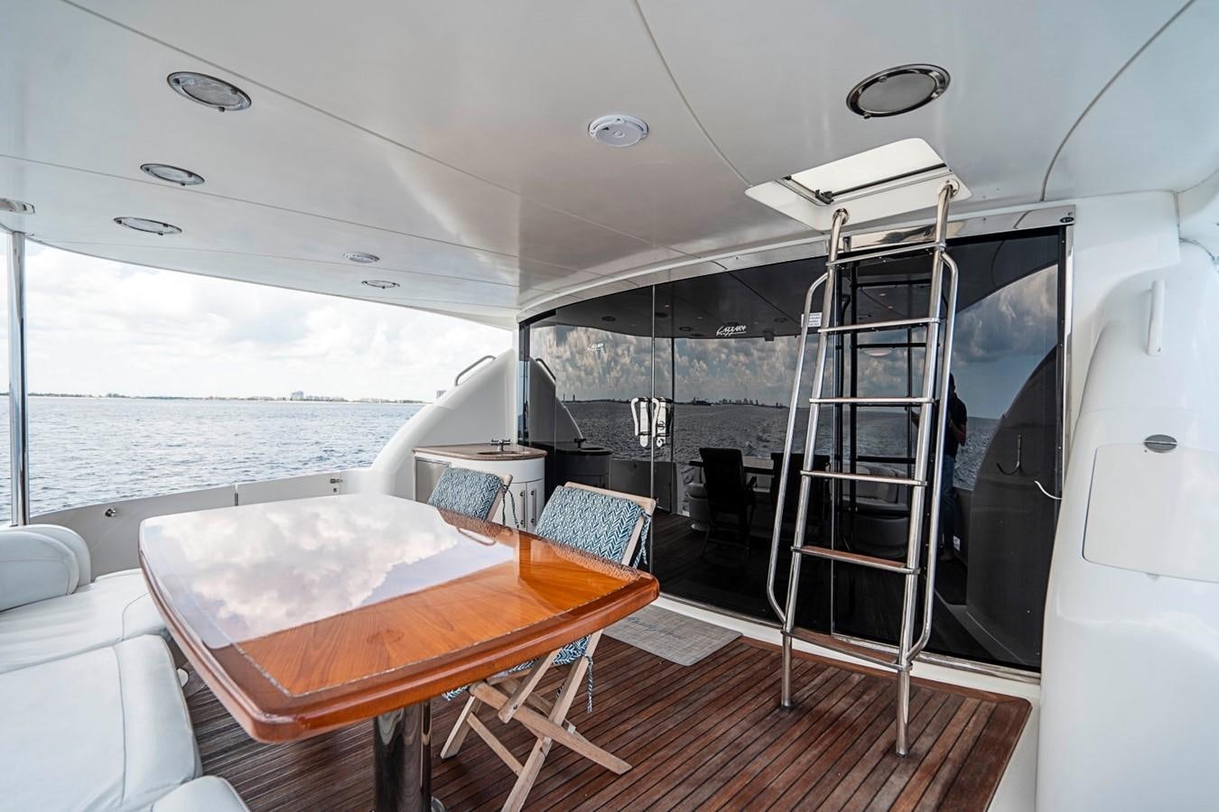 a room with a table and chairs aboard RENDEZVOUS Yacht for Sale