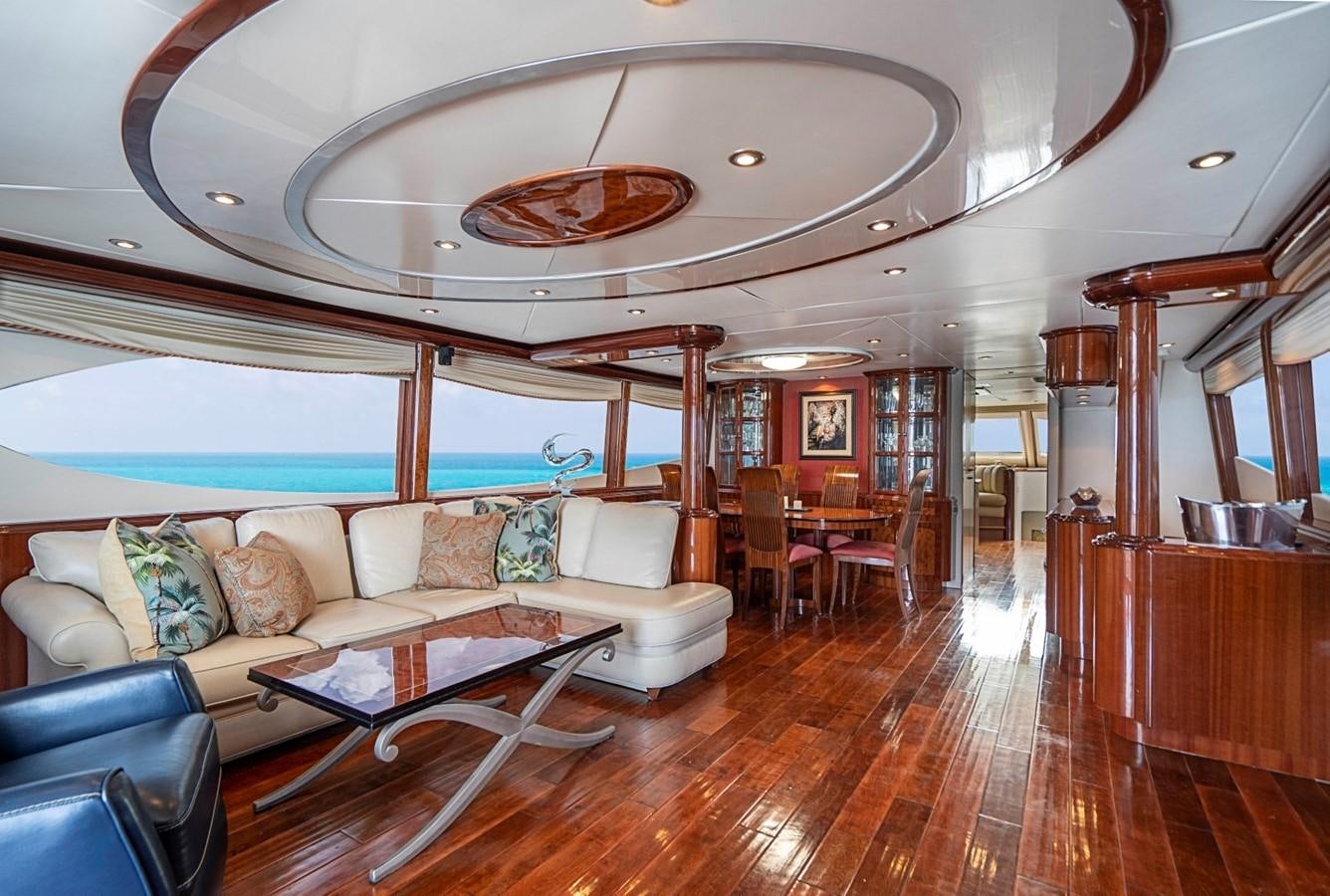 a living room with a large mirror aboard RENDEZVOUS Yacht for Sale