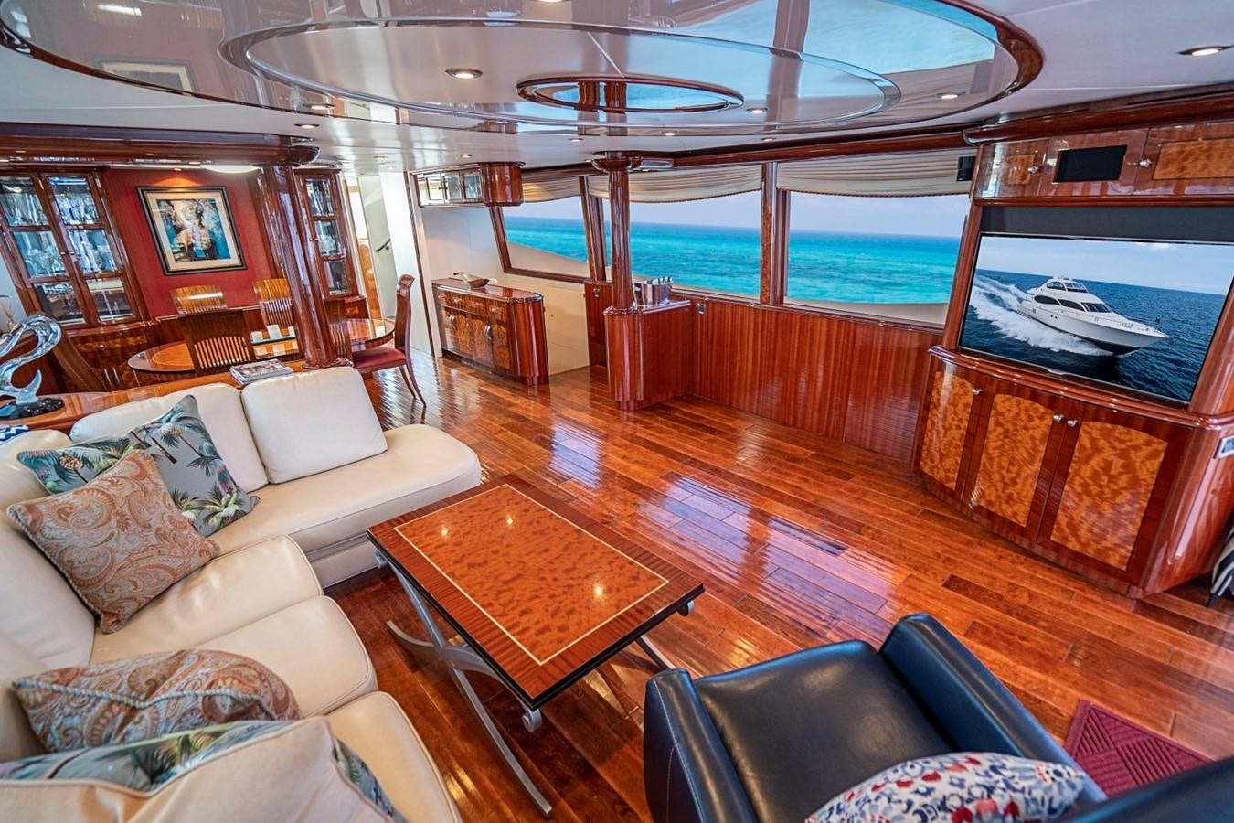 a living room with a wood floor aboard RENDEZVOUS Yacht for Sale