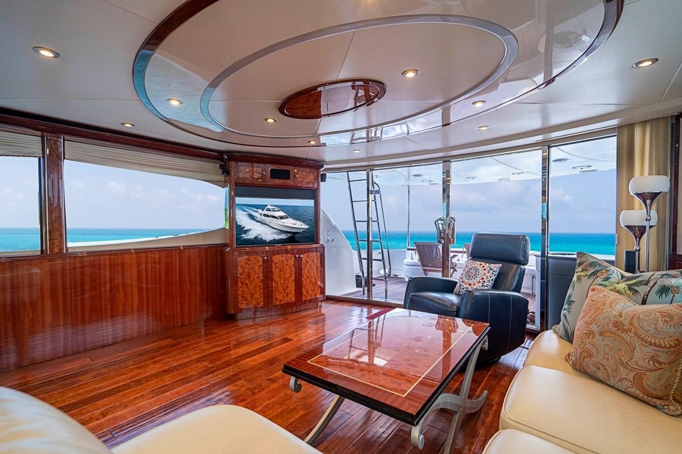 a living room with a wood floor aboard RENDEZVOUS Yacht for Sale