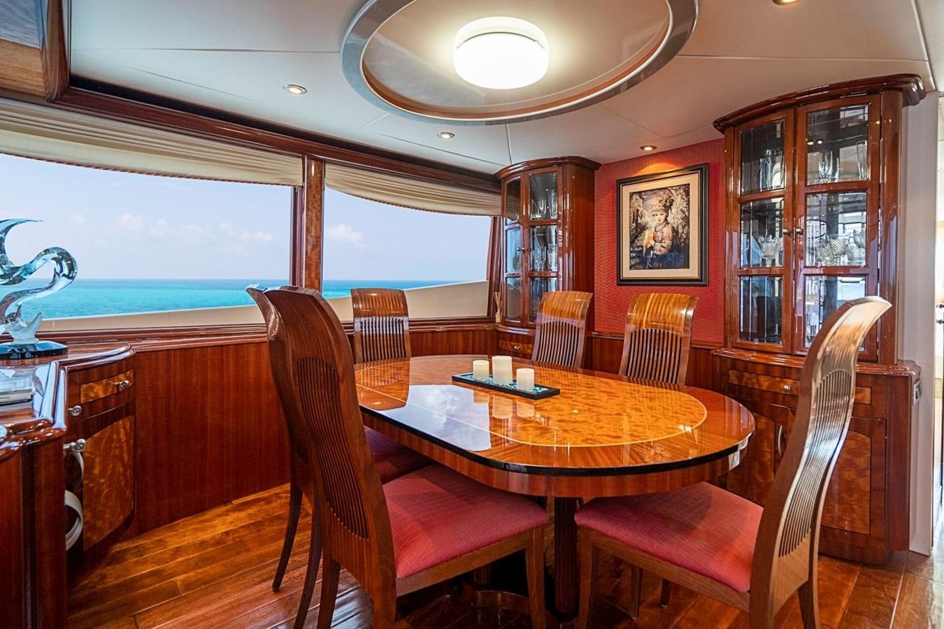 a dining table in a room aboard RENDEZVOUS Yacht for Sale