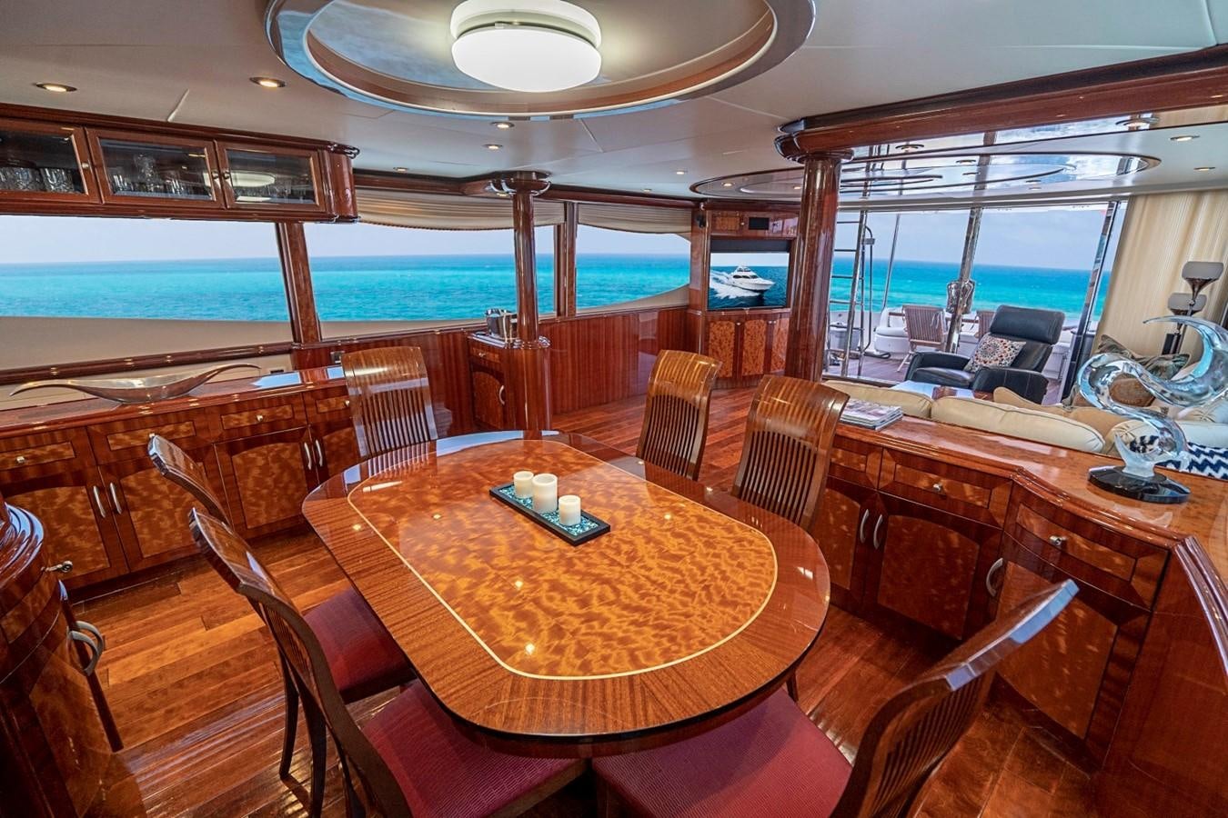 a room with a table and chairs aboard RENDEZVOUS Yacht for Sale
