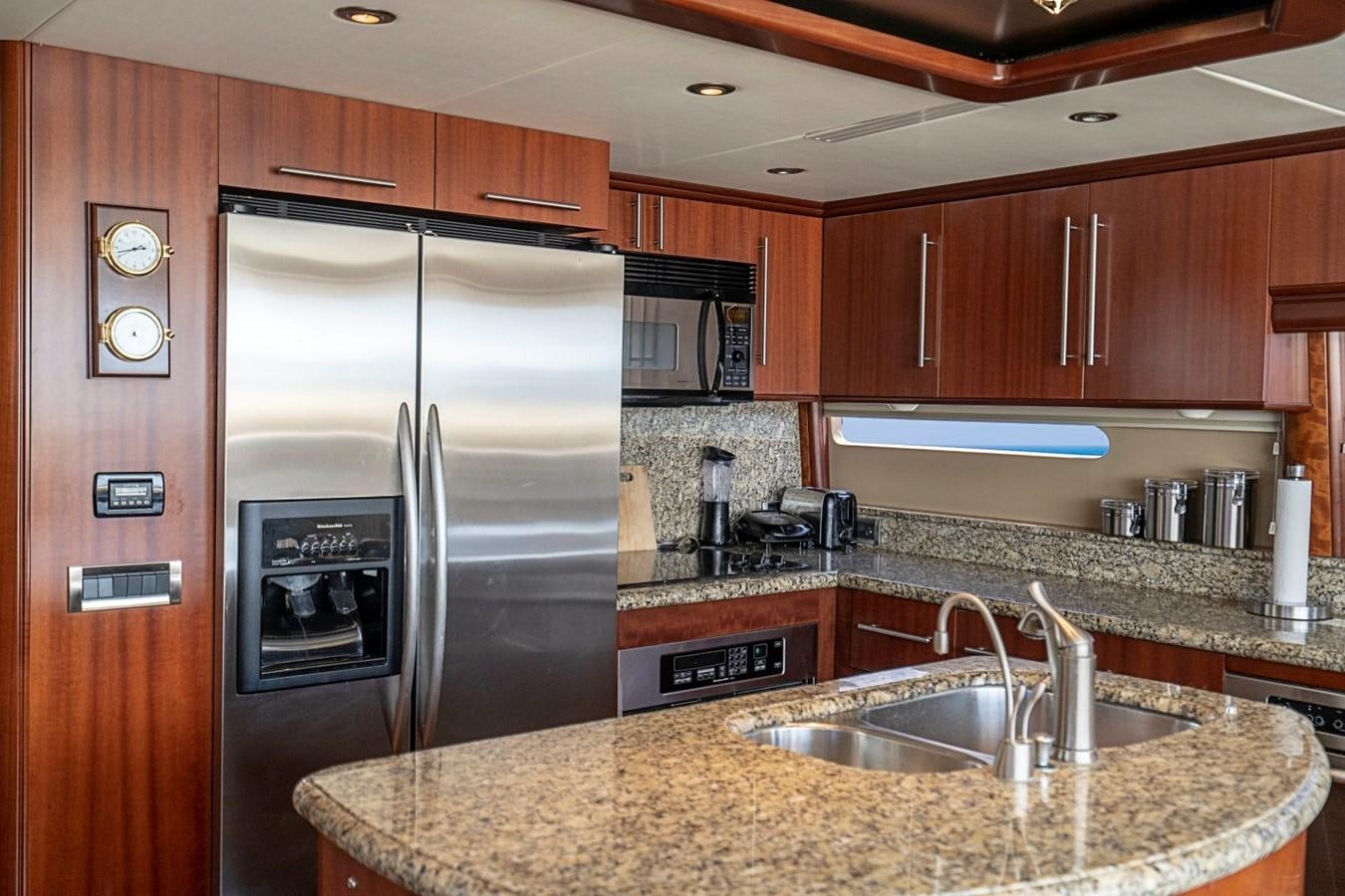 a kitchen with stainless steel appliances aboard RENDEZVOUS Yacht for Sale