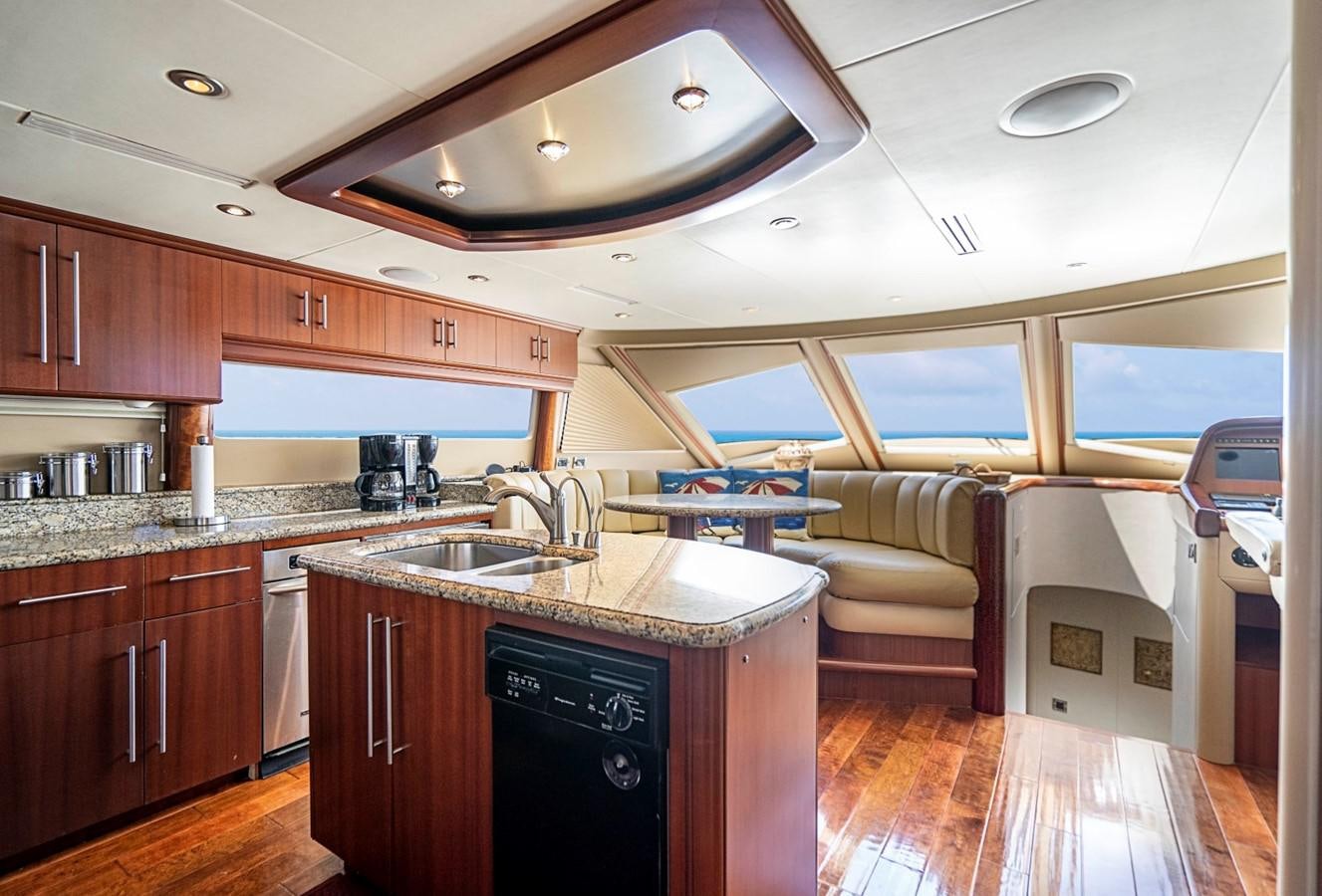 a kitchen with a large island aboard RENDEZVOUS Yacht for Sale