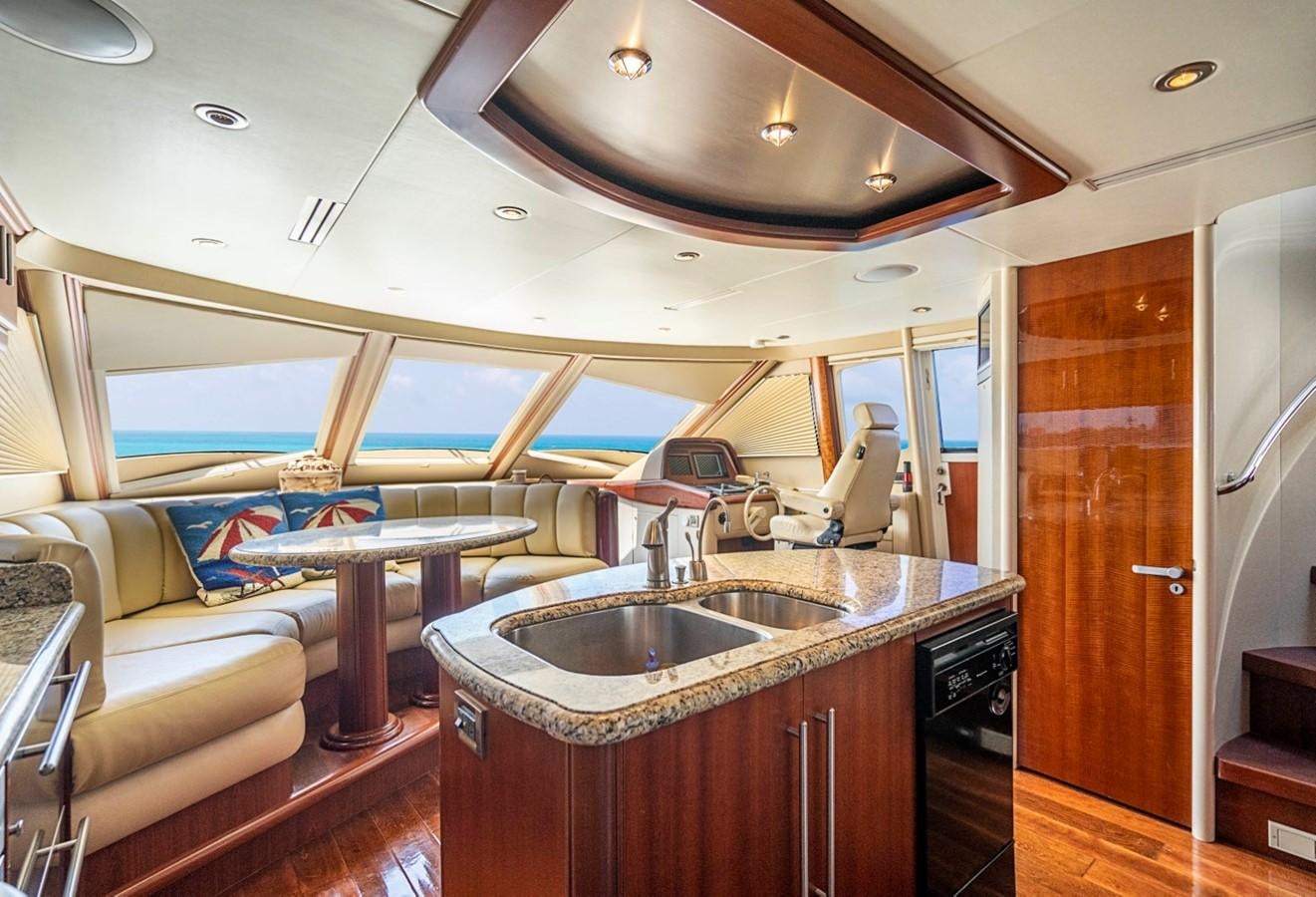 a kitchen with a sink and a couch aboard RENDEZVOUS Yacht for Sale