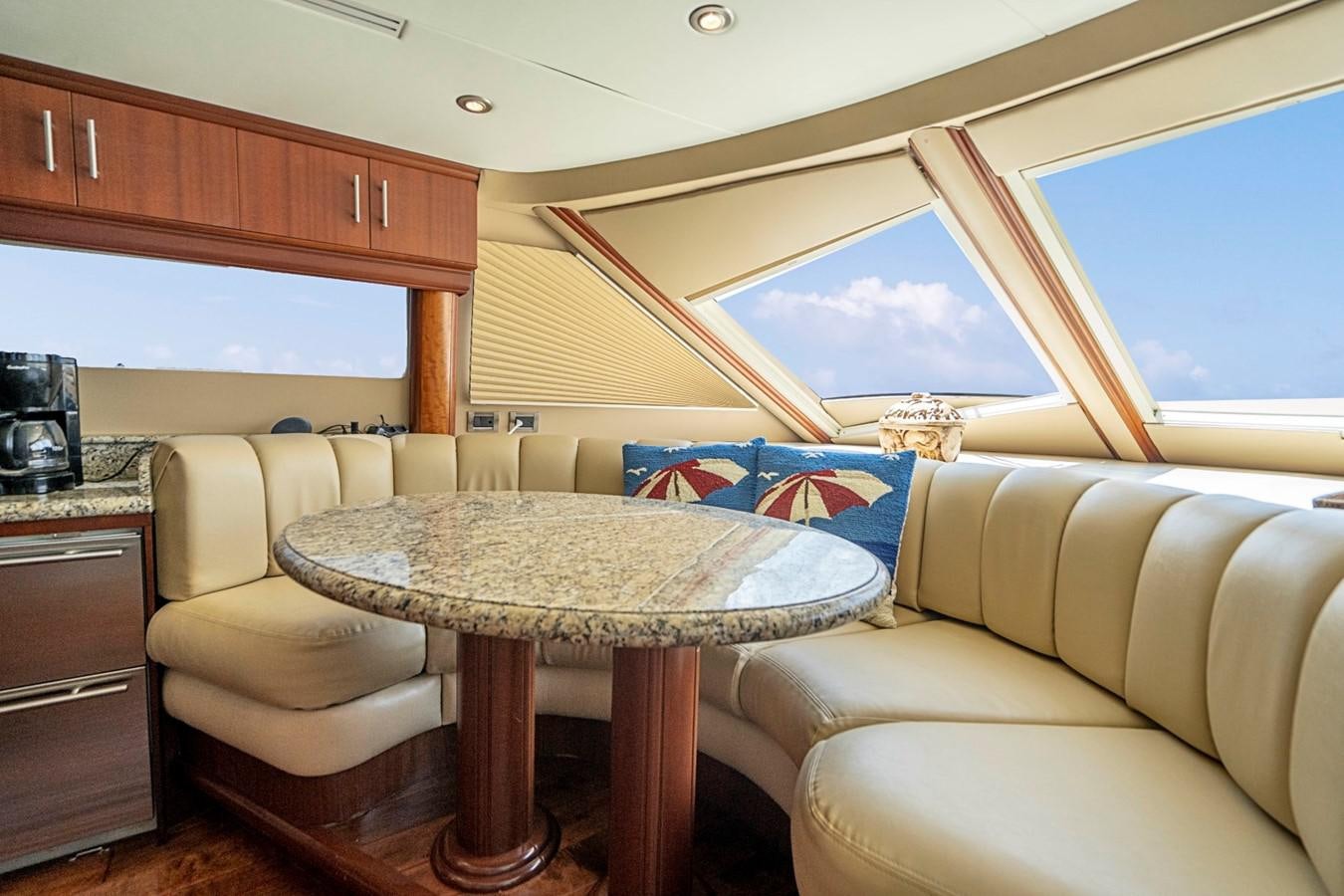 a living room with a couch and a table aboard RENDEZVOUS Yacht for Sale