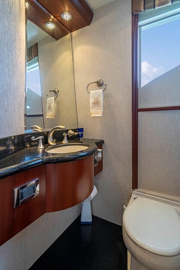 a bathroom with a sink and a toilet aboard RENDEZVOUS Yacht for Sale