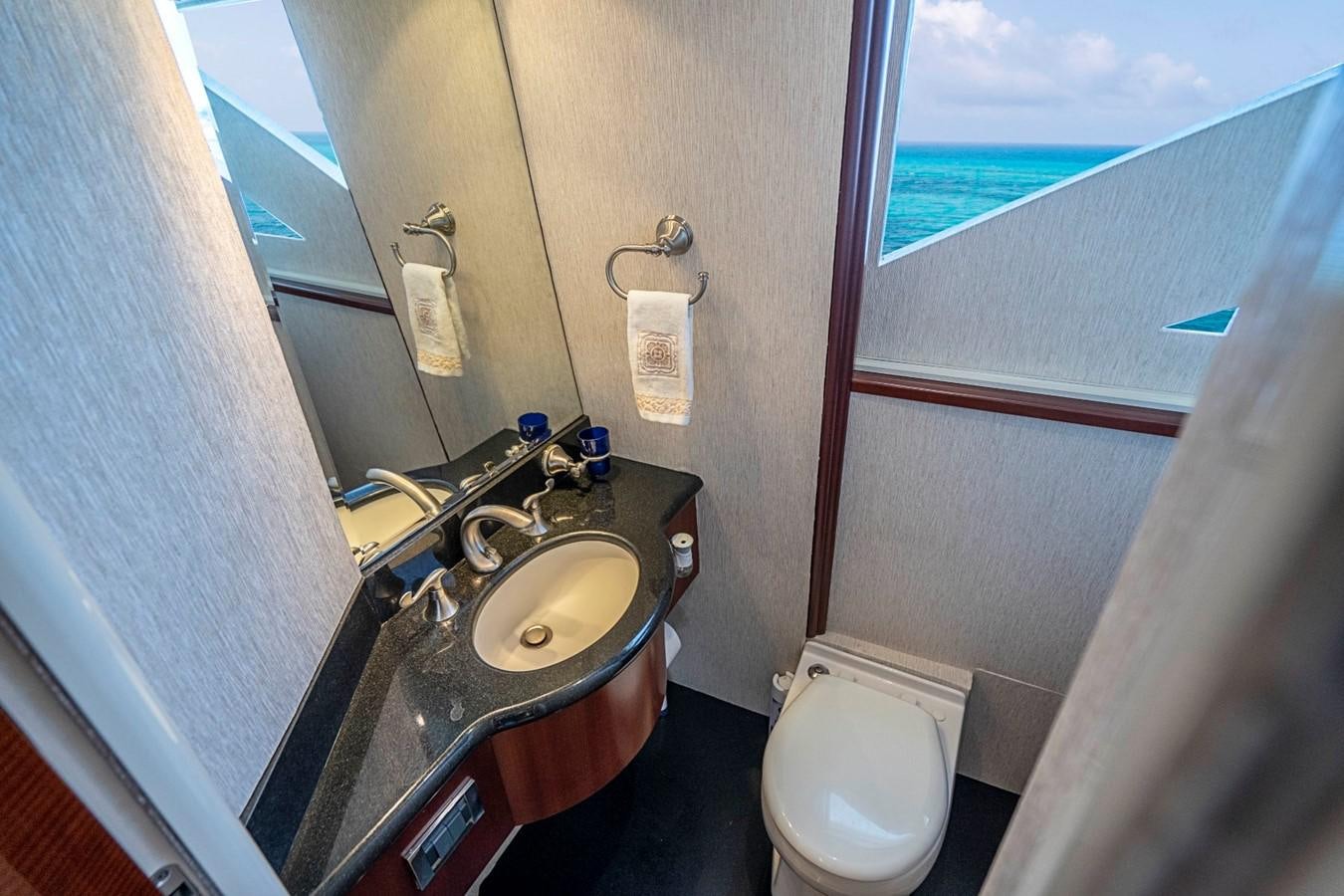 a bathroom with a sink and a toilet aboard RENDEZVOUS Yacht for Sale
