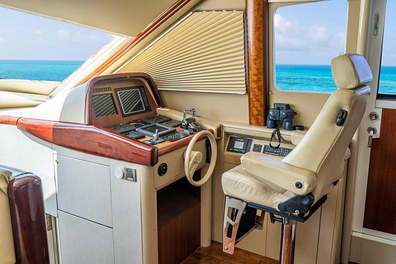 a boat with a desk and computer aboard RENDEZVOUS Yacht for Sale