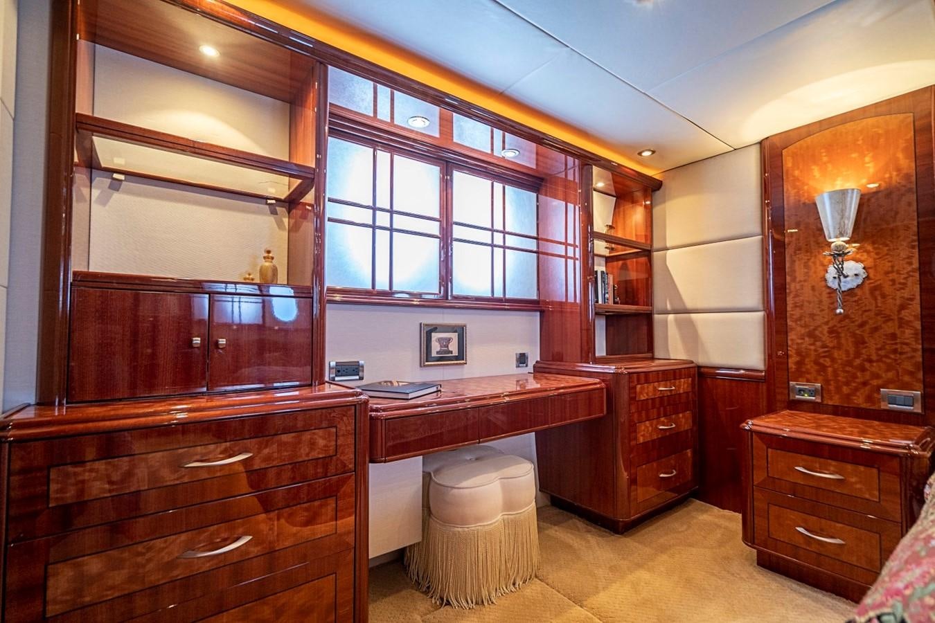 a kitchen with wooden cabinets aboard RENDEZVOUS Yacht for Sale