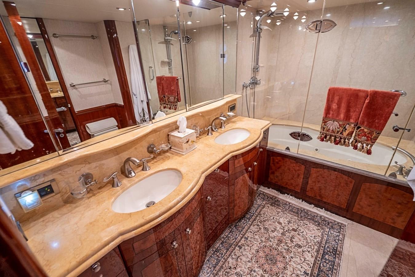 a bathroom with a large mirror aboard RENDEZVOUS Yacht for Sale