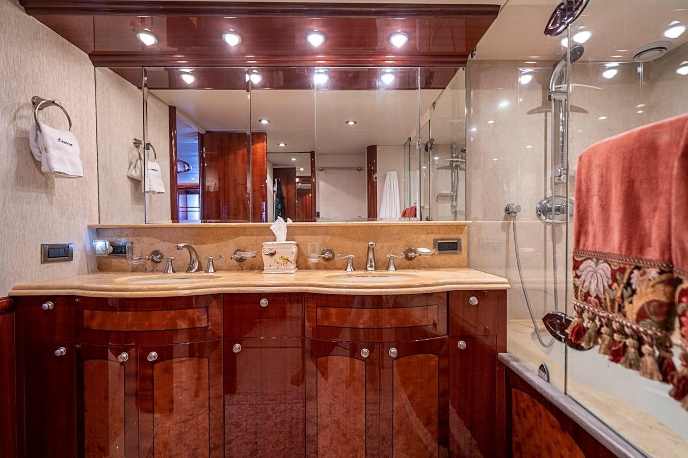 a bathroom with a sink and a mirror aboard RENDEZVOUS Yacht for Sale